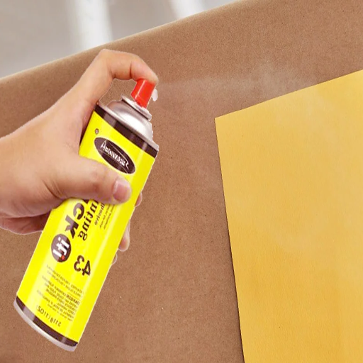 When should I use spray adhesive versus traditional glue?